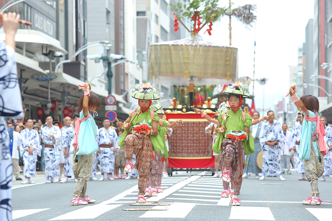 People pulling floats with gorgeous decoration